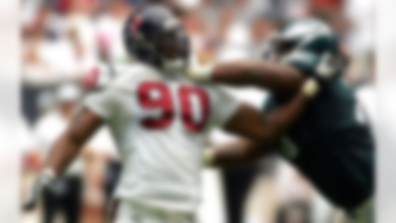 HOUSTON - SEPTEMBER 10:  Defensive end Mario Williams #90 of the Houston Texans pushes off against Shawn Andrews #73 of the Philadelphia Eagles on September 10, 2006 at Reliant Stadium in Houston, Texas. The Eagles defeated the Texans 24-10. Photo by Getty Images.
