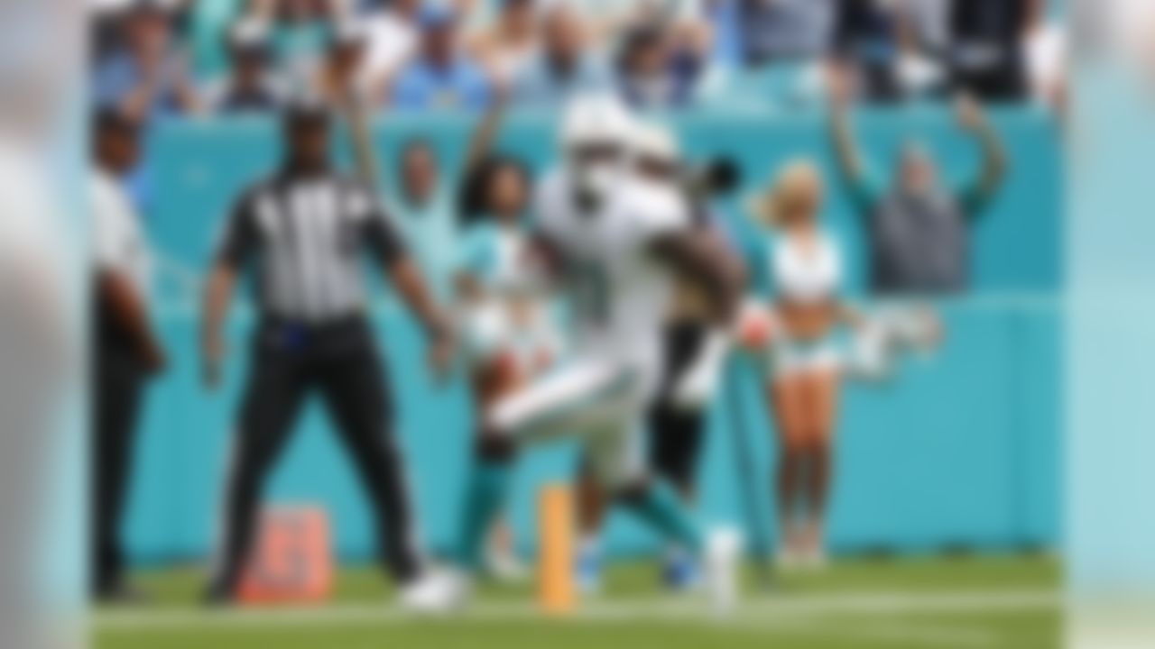 Miami Dolphins wide receiver DeVante Parker (11) runs for a touchdown, during the first half at an NFL football game against the Los Angeles Chargers, Sunday, Sept. 29, 2019, in Miami Gardens, Fla. AP Photo/Wilfredo Lee)