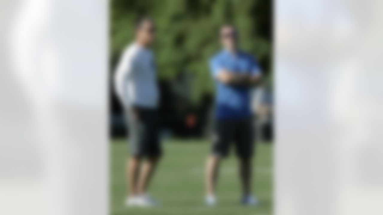 Detroit Lions president Tom Lewand, right, and coach Jim Schwartz, left, talk during the Lions' NFL football training camp Sunday, July 29, 2012, in Allen Park, Mich. (AP Photo/Duane Burleson)