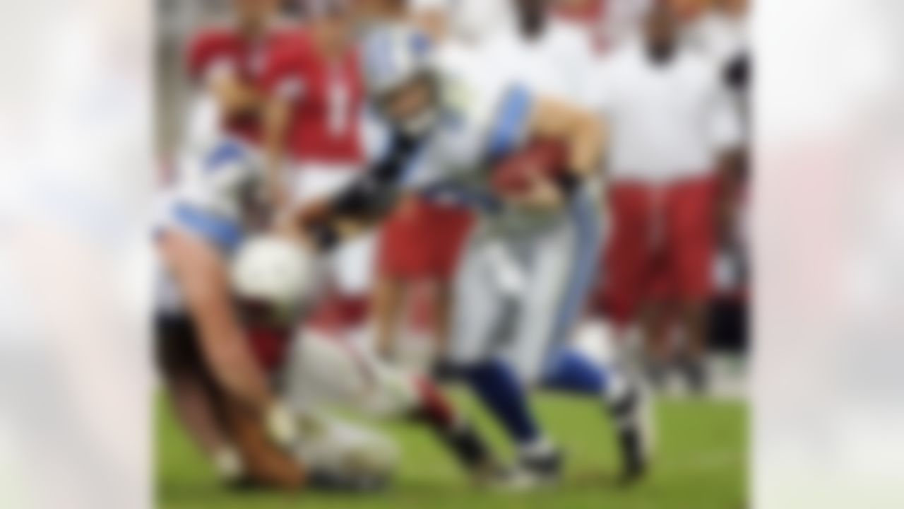 GLENDALE, AZ - NOVEMBER 19: Quarterback John Kitna #8 of the Detroit Lions is brought down by Chike Okeafor #56 of the Arizona Cardinals in the second half November 19, 2006 at University of Phoenix Stadium in Glendale, Arizona. The Cardinals defeated the Lions, 17-10. Photo by Getty Images.