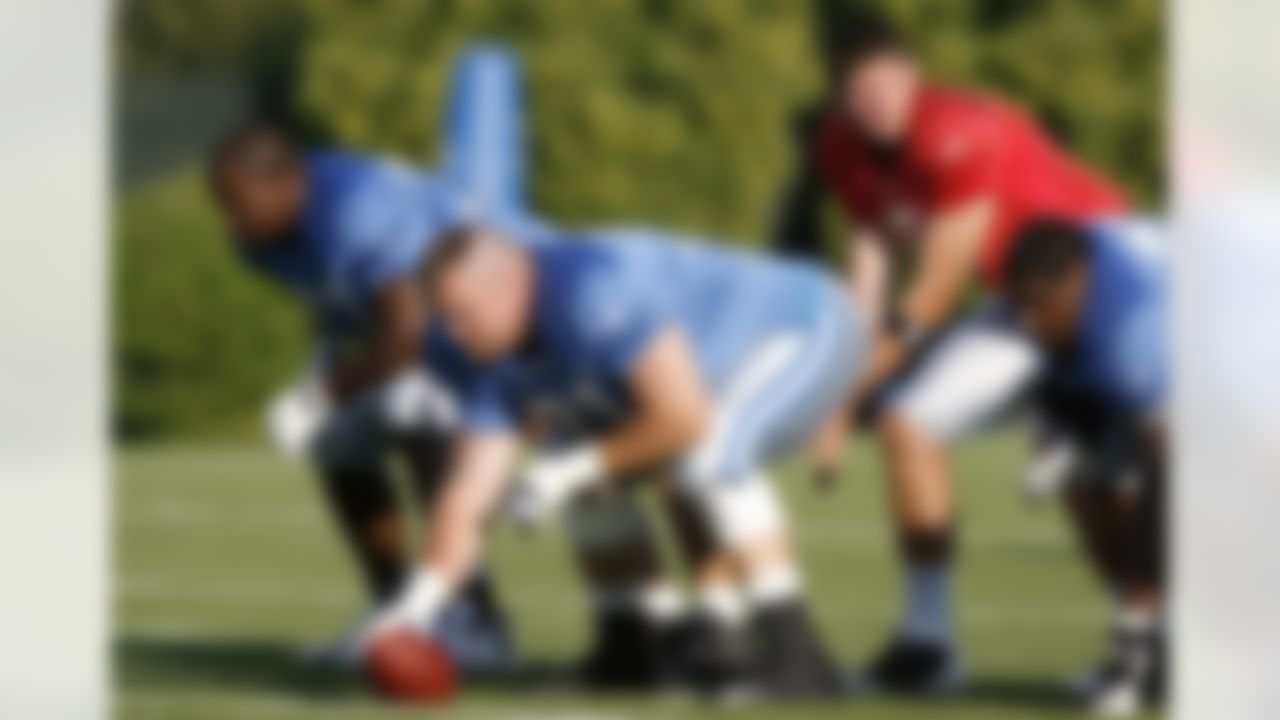 ALLEN PARK, MI - JULY 24: Gosder Cherilus #77 of the Detroit Lions lines up with Corey Hulsey #71 and Dan Orlovsky #6 during training camp at the Detroit Lions Headquarters and Training Facility on July 24, 2008 in Allen Park, Michigan. (Photo by Gregory Shamus/Getty Images)