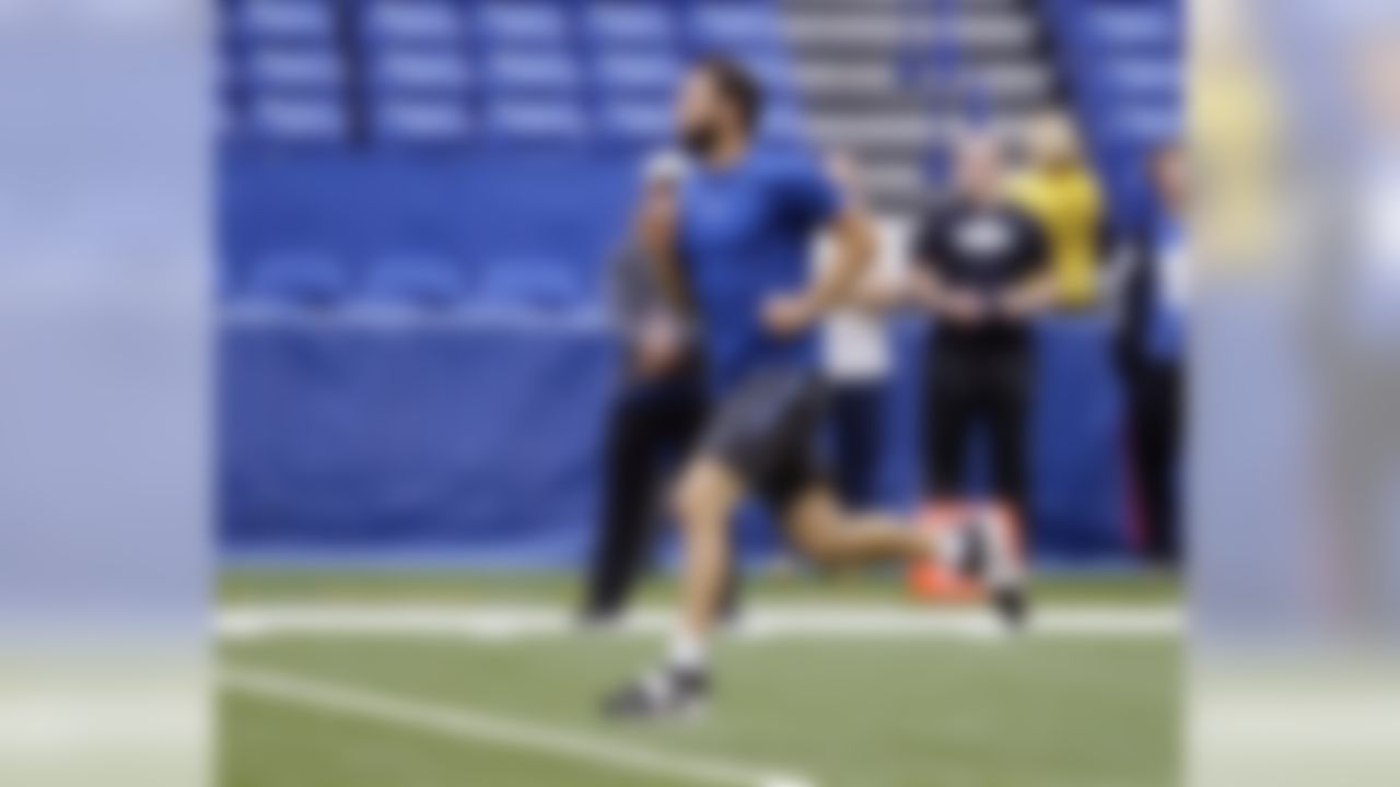 Indianapolis Colts' Andrew Luck runs before the start of an NFL football game between the Indianapolis Colts and the Jacksonville Jaguars, Sunday, Oct. 4, 2015, in Indianapolis. Luck is inactive Sunday and will miss his first NFL game because of a right shoulder injury. (AP Photo/Michael Conroy)