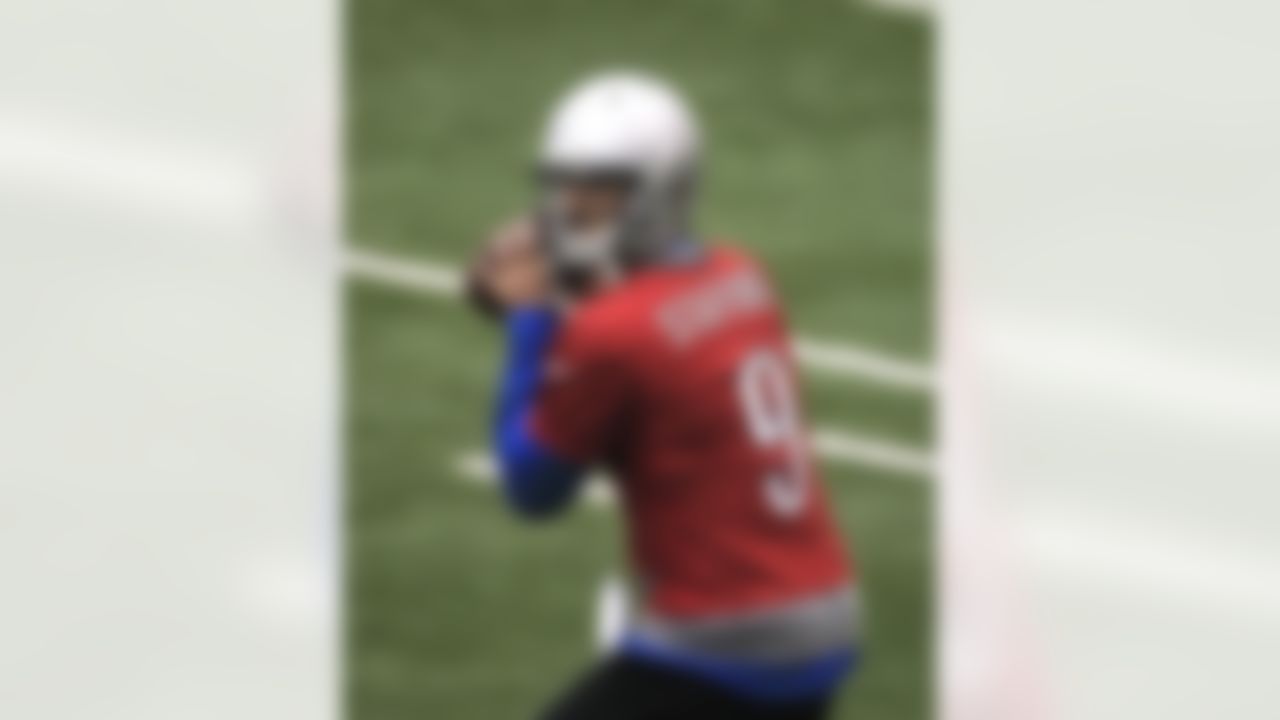 Detroit Lions quarterback Matthew Stafford prepares to pass the ball during training camp at the team's NFL football training facility in Allen Park, Mich., Friday, July 27, 2012. (AP Photo/Carlos Osorio)