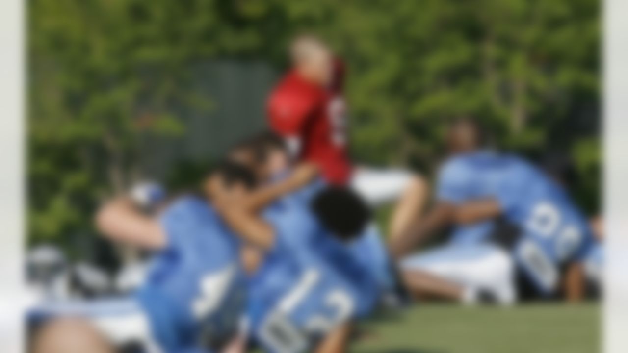 ALLEN PARK, MI - JULY 24: Jon Kitna #8 of the Detroit Lions stretches with teammates during training camp at the Detroit Lions Headquarters and Training Facility on July 24, 2008 in Allen Park, Michigan. (Photo by Gregory Shamus/Getty Images)