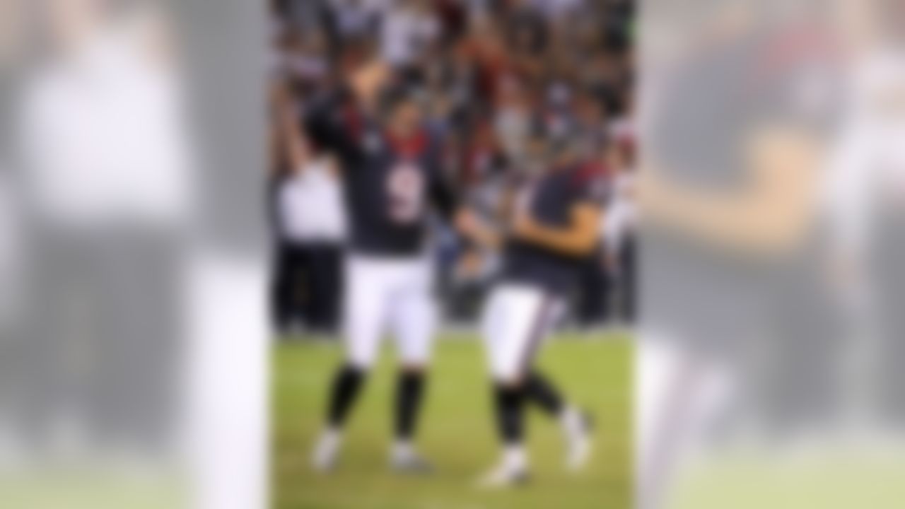 Houston Texans kicker Randy Bullock, celebrates with Shane Lechler after kicking the game winning field goal against the San Diego Chargers during the second half of an NFL football game Monday, Sept. 9, 2013, in San Diego. (AP Photo/Denis Poroy)