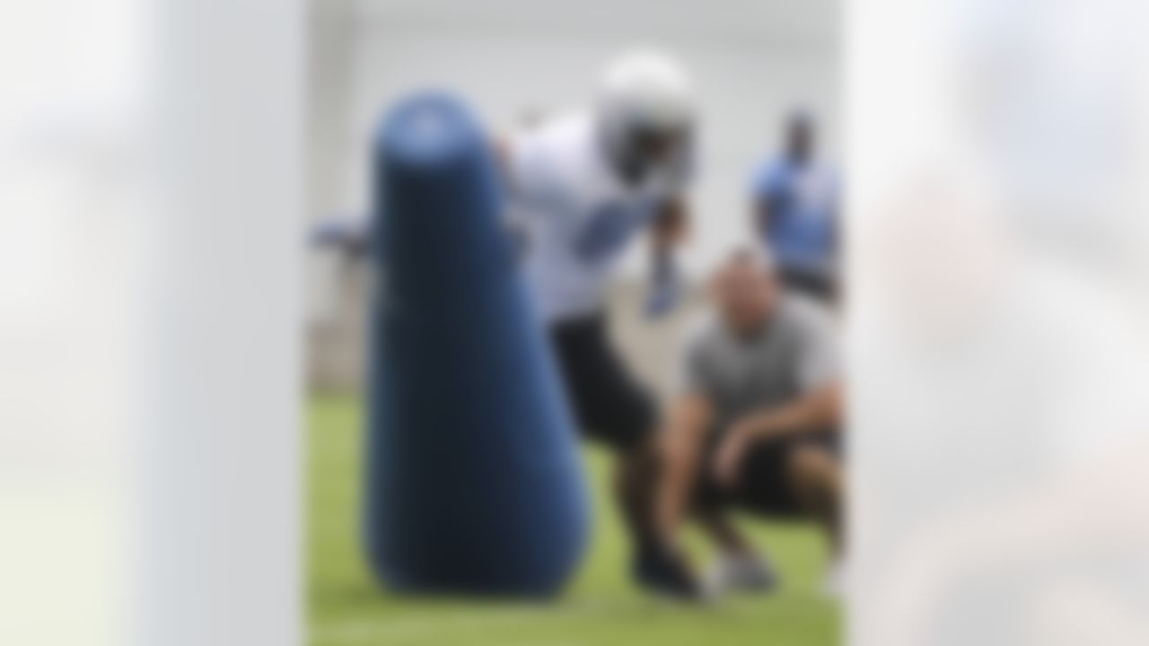 Detroit Lions defensive tackle Ndamukong Suh runs through tackling dummies during drills at NFL football training camp in Allen Park, Mich., Wednesday, Aug. 3, 2011. (AP Photo/Carlos Osorio)