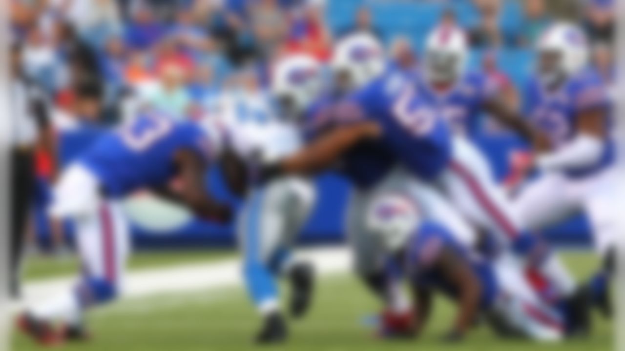 Detroit Lions running back Theo Riddick (41) is brought down by a host of Buffalo Bills players during the first half of a preseason NFL football game, Thursday, Aug. 28, 2014, in Orchard Park, N.Y. (AP Photo/Bill Wippert)