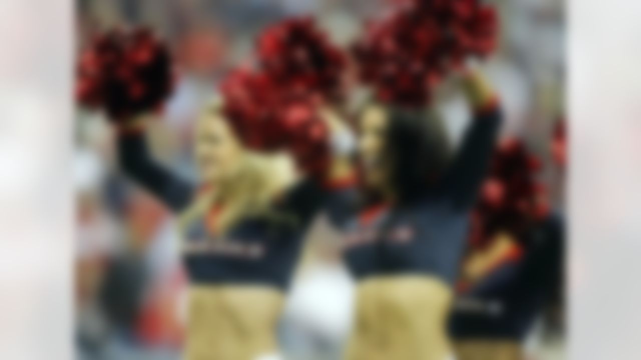 Houston Texans cheerleaders perform against the Cincinnati Bengals during the second quarter of the AFC Wild Card playoff game at Reliant Stadium. (Brett Davis/US Presswire)