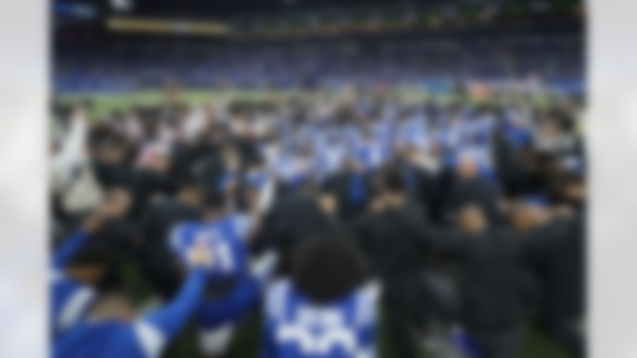 The Houston Texans and Indianapolis Colts gather on the field before their NFL football game in support of Buffalo Bills safety Damar Hamlin, Sunday, Jan. 8, 2023, in Indianapolis.