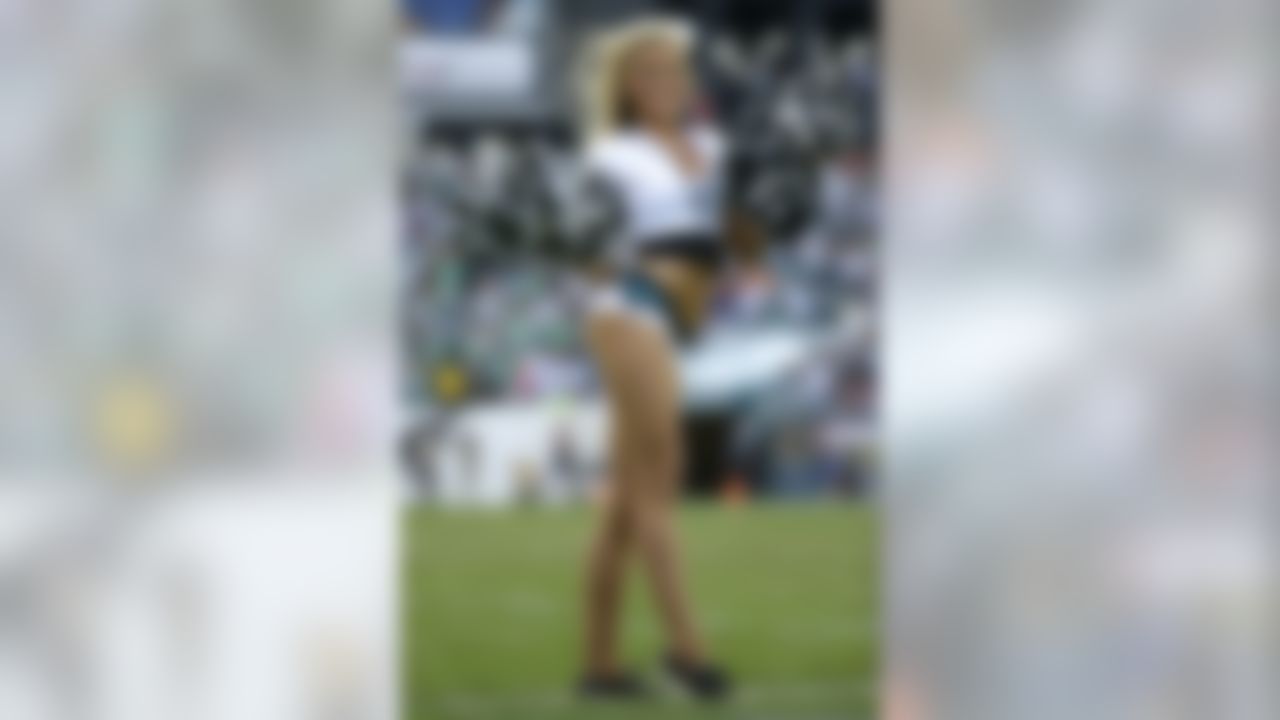 A Philadelphia Eagles cheerleader performs during the first half of an NFL football game against the Washington Redskins in Philadelphia, Sunday, Nov. 17, 2013. (AP Photo/Matt Slocum)