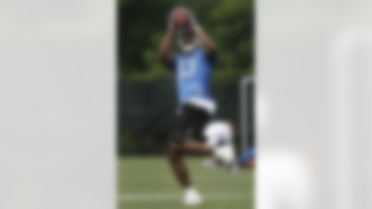 Detroit Lions wide receiver Nate Burleson catches a football during NFL minicamp in Allen Park,  Mich., Wednesday, June 23, 2010. (AP Photo/Paul Sancya)