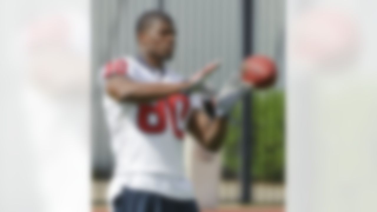 Houston Texans receiver Andre Johnson warms up during an NFL football mini camp, Thursday, May 20, 2010, in Houston. Johnson is in a contract dispute with the Texans and missed the opening three voluntary practices. (AP Photo/Dave Einsel)
