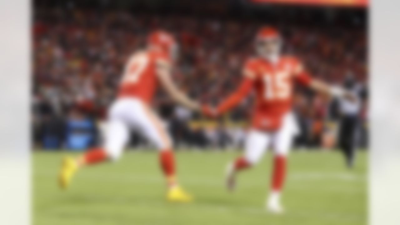 Kansas City Chiefs tight end Travis Kelce (87) and Kansas City Chiefs quarterback Patrick Mahomes (15) celebrate after a play during an NFL Conference Championship playoff game against the Cincinnati Bengals on Sunday, January 29, 2023 in Kansas City, Missouri.
