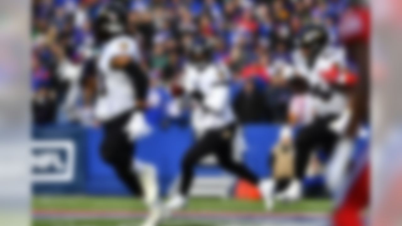 Baltimore Ravens quarterback Lamar Jackson looks to pass during the first half of an NFL football game against the Buffalo Bills in Orchard Park, N.Y., Sunday, Dec. 8, 2019. (AP Photo/Adrian Kraus)