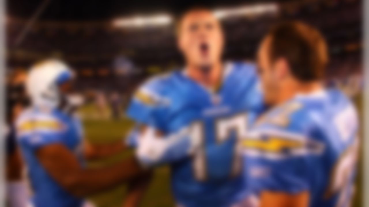 San Diego Chargers quarterback Philip Rivers celebrates with teammates Jacob Hester and Michael Bennett after defeating the Indianapolis Colts in overtime, 23-17, at Qualcomm Stadium. (Photo by Ben Liebenberg/NFL.com)