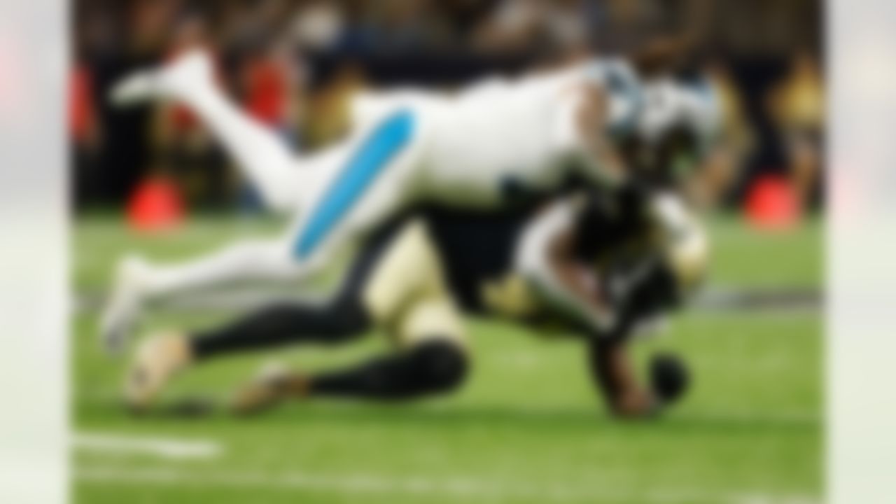New Orleans Saints running back Alvin Kamara (41) is tackled by Carolina Panthers outside linebacker Shaq Thompson (7) during an NFL football game on Sunday, January 2, 2022 in New Orleans, Louisiana.