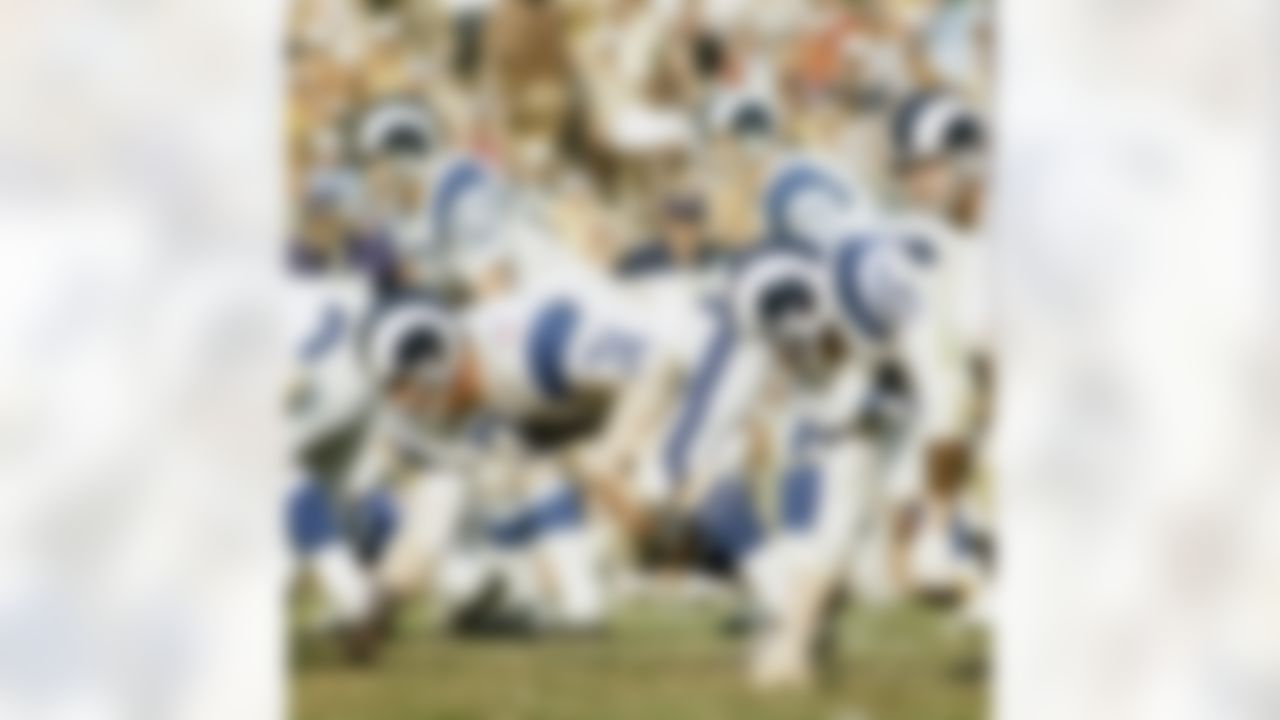 Los Angeles Rams Hall of Fame defensive tackle Merlin Olsen (74) lines up next to Hall of Fame defensive end Deacon Jones (75) in 1971. (National Football League)