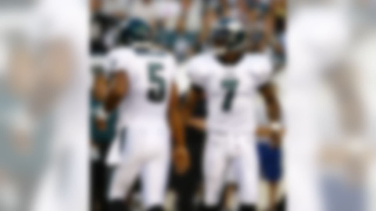 Philadelphia Eagles quarterbacks Donovan McNabb, left, and Michael Vick switch out in the first quarter of a preseason NFL football game against the Jacksonville Jaguars, Thursday, Aug. 27, 2009, in Philadelphia. (AP Photo/Mel Evans)