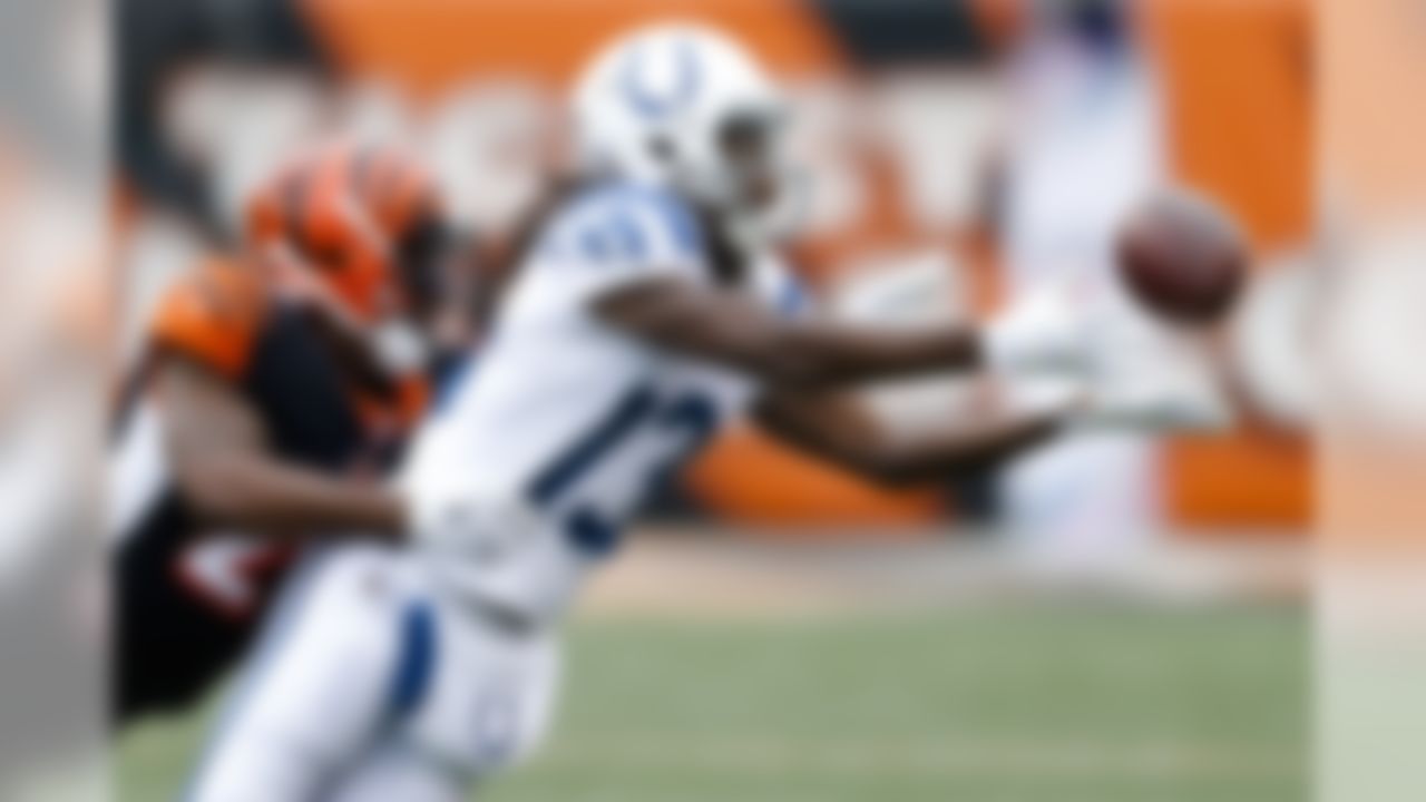 Indianapolis Colts wide receiver T.Y. Hilton (13) misses a pass with Cincinnati Bengals cornerback Darqueze Dennard, left, in pursuit in the first half of an NFL football game, Sunday, Oct. 29, 2017, in Cincinnati. (AP Photo/Gary Landers)