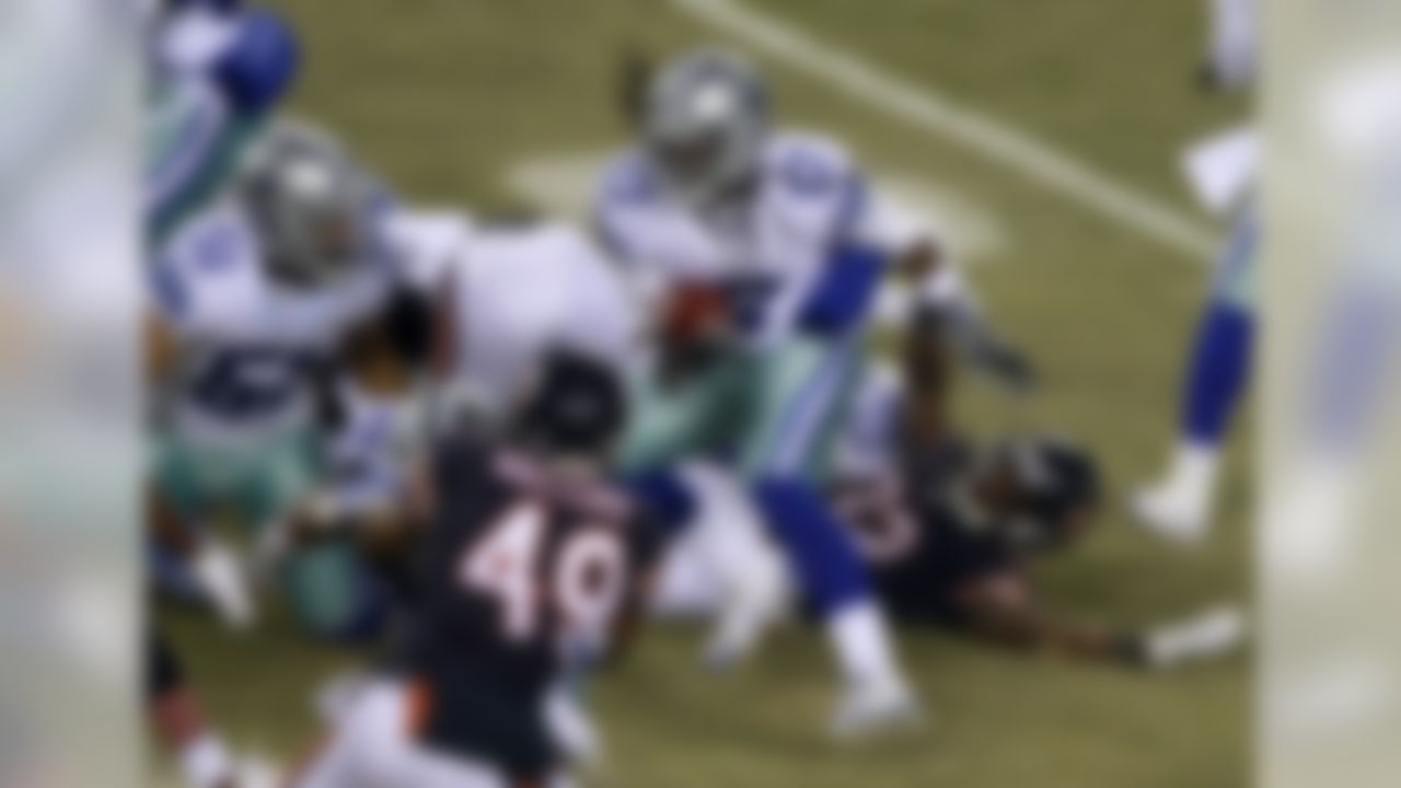 Dallas Cowboys' Dwayne Harris (17) caries the ball on a kick off return during the first half of an NFL football game against the Chicago BearsThursday, Dec. 4, 2014, in Chicago. (AP Photo/Kiichiro Sato)