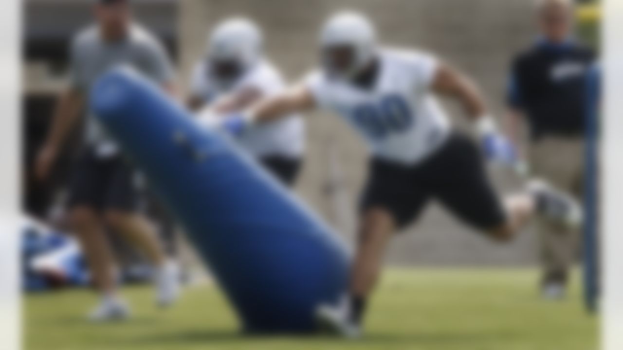 Detroit Lions defensive tackles Ndamukong Suh (90) and Demetrius Amos knock a tacking dummy during rookie football mini-camp at the team's practice facility in Allen Park, Mich, Friday, April 30, 2010. Suh says he has to start off at "ground zero" because being the No. 2 pick in the NFL draft is no longer relevant. Lions coach Jim Schwartz says Suh got his message Friday during the first of a three-day rookie orientation camp. (AP Photo/Carlos Osorio)