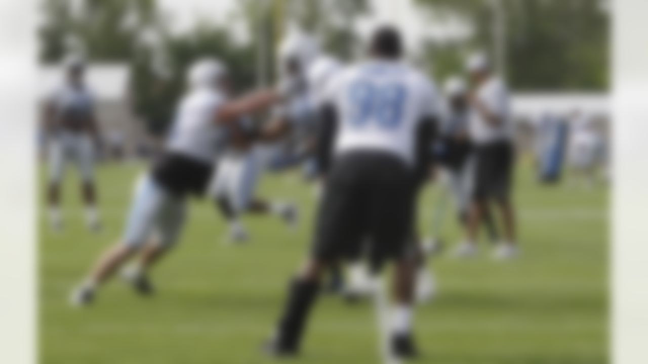 Detroit Lions defensive tackle Nick Fairley (98) wearing a leg brace, watches drills during practice at NFL football training camp in Allen Park, Mich., Tuesday, Aug. 2, 2011. (AP Photo/Carlos Osorio)
