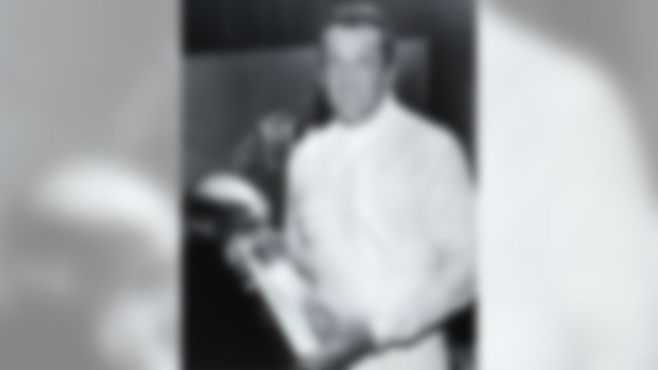 Oakland Raiders Hall of Fame owner Al Davis, President of the General Partner, poses with the Lombardi trophy. (Pro Football Hall of Fame)
