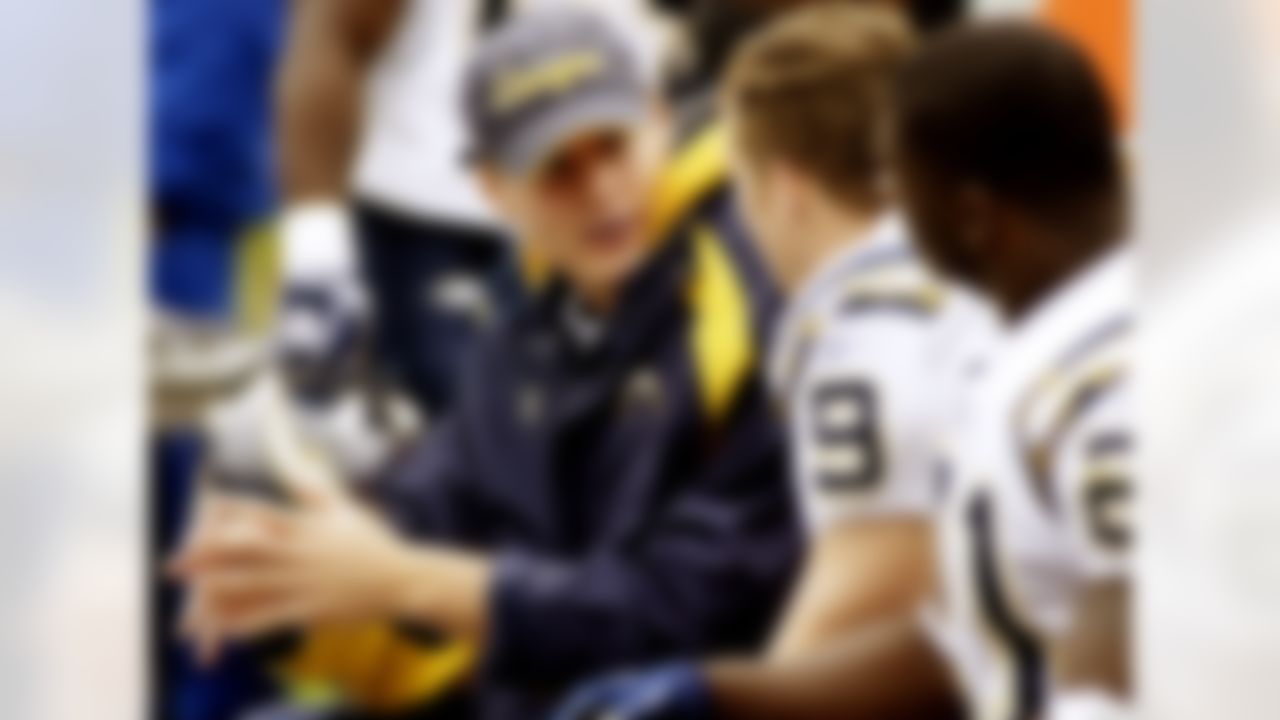 San Diego backup quarterback Philip Rivers (left) talks to starting quarterback Drew Brees (9) during the Chargers 17-6 win over Carolina Sunday, Oct. 24, 2004 at Bank of America Stadium in Charlotte, N.C. (Photo by Kevin C.  Cox/NFL)