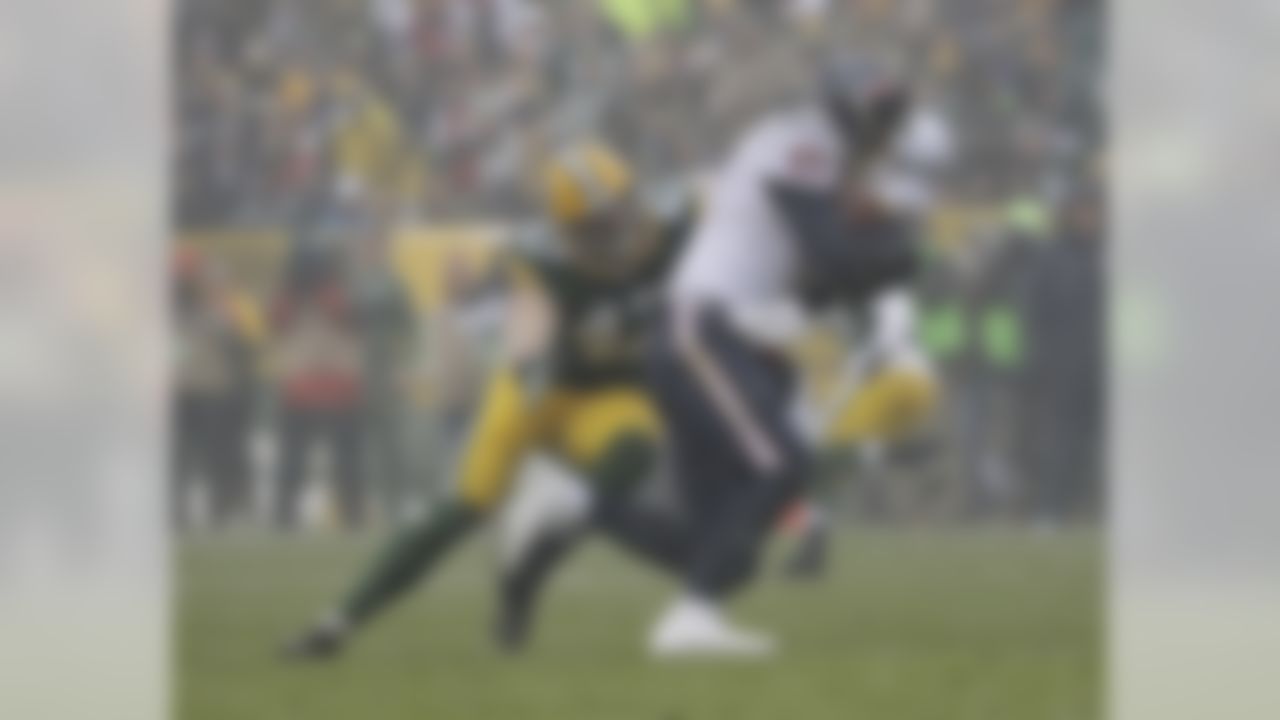 Houston Texans' Brock Osweiler runs away from Green Bay Packers' Jake Ryan during the first half of an NFL football game Sunday, Dec. 4, 2016, in Green Bay, Wis. (AP Photo/Morry Gash)