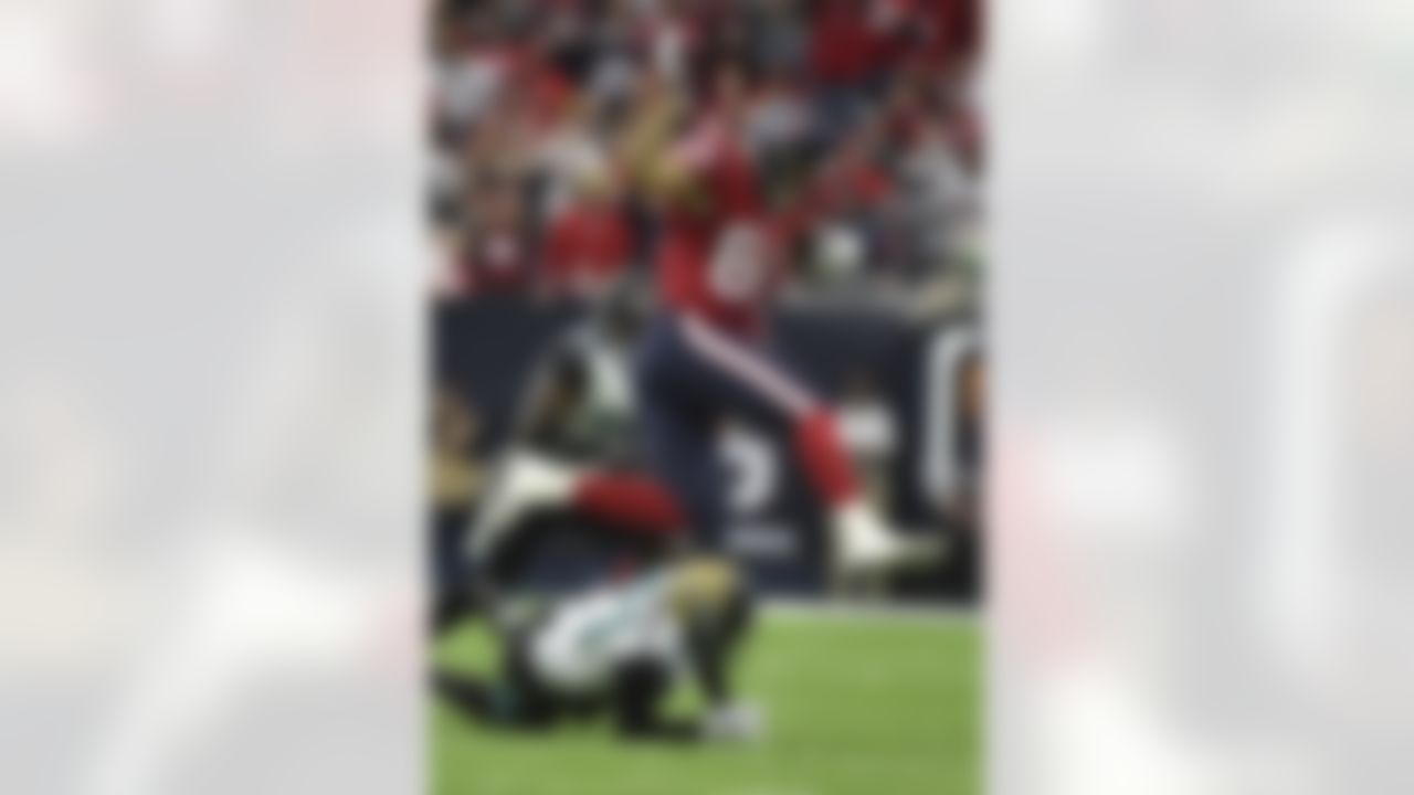 Houston Texans tight end Ryan Griffin (84) leaps the tackle of Jacksonville Jaguars' Prince Amukamara (21) during the first half of an NFL football game Sunday, Dec. 18, 2016, in Houston. (AP Photo/Eric Christian Smith)