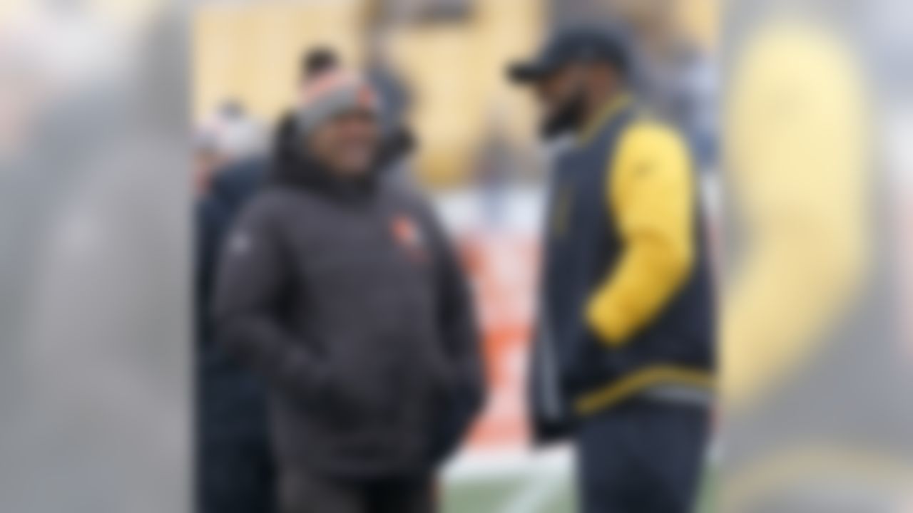 Cleveland Browns head coach Hue Jackson, left, and Pittsburgh Steelers head coach Mike Tomlin visit on the field during warmups before an NFL football game in Pittsburgh, Sunday, Dec. 31, 2017. (AP Photo/Keith Srakocic)