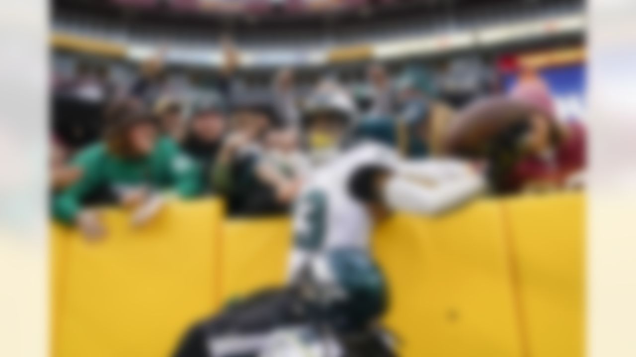 Philadelphia Eagles safety Rodney McLeod (23) celebrates with fans after making an interception against Washington Football Team quarterback Taylor Heinicke (4) in the final minute the second half of an NFL football game, Sunday, Jan. 2, 2022, in Landover, Md. Philadelphia won 20-16.