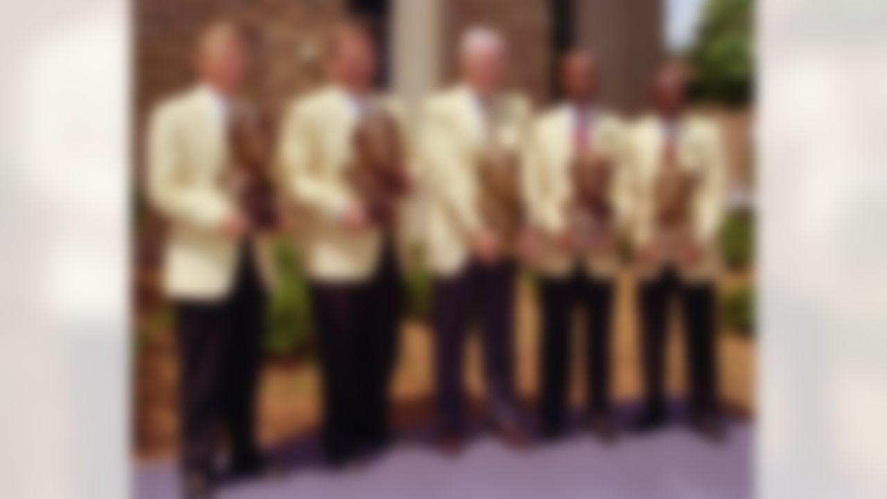 The 1996 class of enshrinees pose with their busts after induction into the Pro Football Hall of Fame Saturday, July 27, 1996, in Canton, Ohio. From left: Joe Gibbs, Dan Dierdorf, Lou Creekmur, Mel Renfro and Charlie Joiner. (AP Photo/Phil Long)