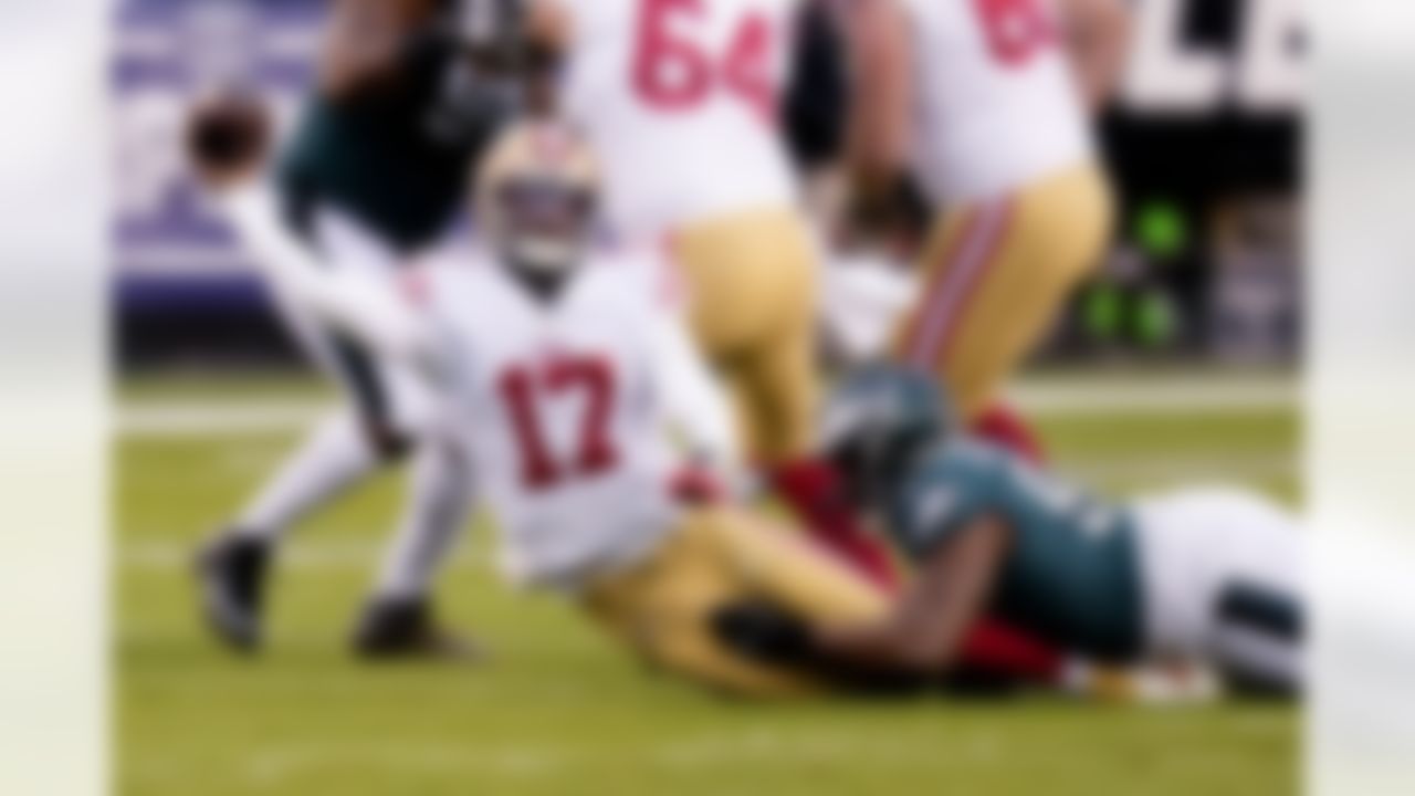 San Francisco 49ers quarterback Josh Johnson (17) passes while being tackled by Philadelphia Eagles defensive tackle Javon Hargrave during the first half of the NFC Championship NFL football game between the Philadelphia Eagles and the San Francisco 49ers on Sunday, Jan. 29, 2023, in Philadelphia.