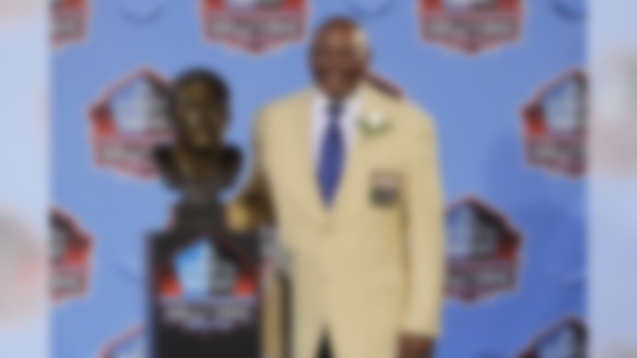 Floyd Little poses with his bust after enshrinement in the Pro Football Hall of Fame in Canton, Ohio Saturday, Aug. 7, 2010. (AP Photo/Mark Duncan)