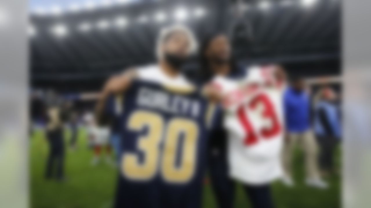 New York Giants wide receiver Odell Beckham (left) and Los Angeles Rams running back Todd Gurley pose for photo after swapping jerseys following an NFL football game at Twickenham Stadium in London, Sunday Oct. 23, 2016. Giants won 17-10. (Ben Liebenberg/NFL)