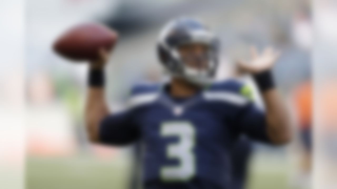 Seattle Seahawks quarterback Russell Wilson throws before a preseason NFL football game against the Chicago Bears, Friday, Aug. 22, 2014, in Seattle. (AP Photo/John Froschauer)