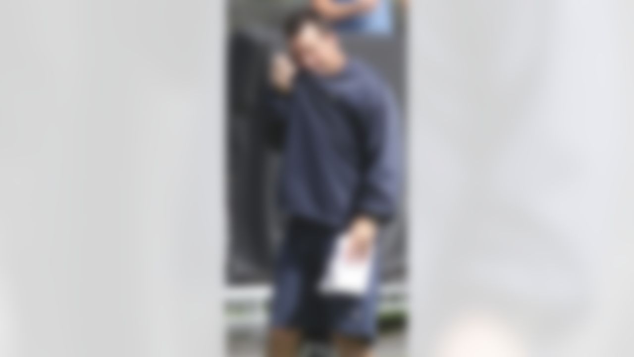 Houston Texans coach Gary Kubiak wipes his face during a practice at NFL football training camp in Metairie, La., Thursday, Aug. 19, 2010. The New Orleans Saints and the Texans are holding joint practice session leading up to their preseason game on Saturday night.  (AP Photo/Bill Haber)