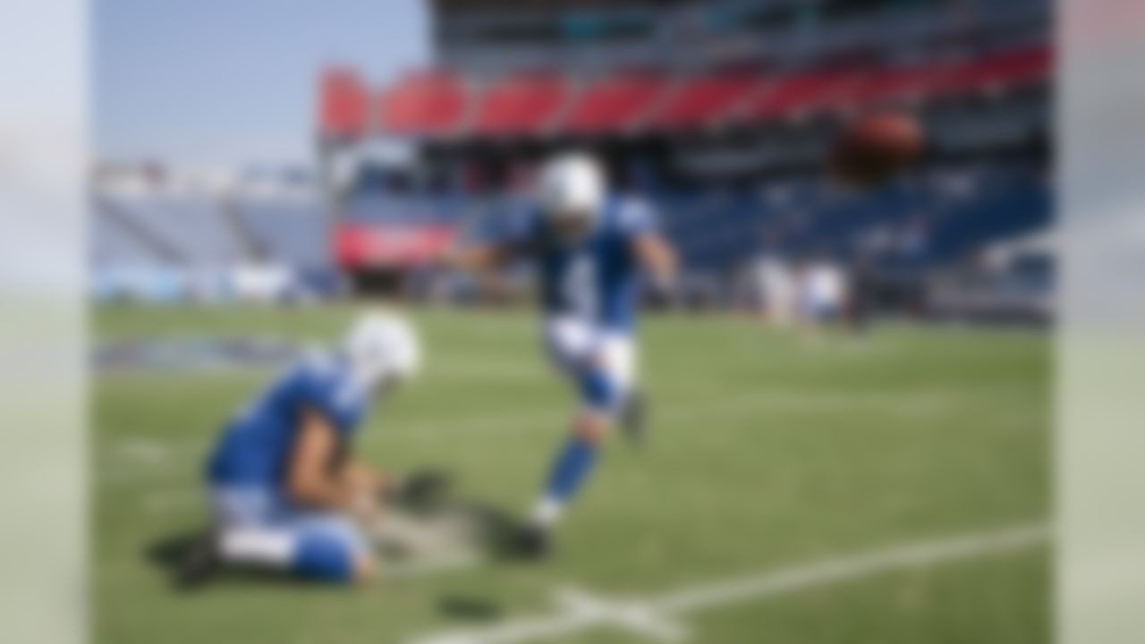 Indianapolis Colts kicker Adam Vinatieri (4) warms up with holder Rigoberto Sanchez (8) before an NFL football game against the Tennessee Titans Sunday, Sept. 15, 2019, in Nashville, Tenn. (AP Photo/James Kenney)