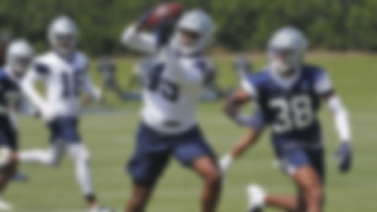 Dallas Cowboys tight end Artayvious Lynn (49) catches a pass as safety Israel Mukuamu (49) defends during the team's NFL football rookie minicamp Saturday, May 15, 2021 in Frisco, Texas.