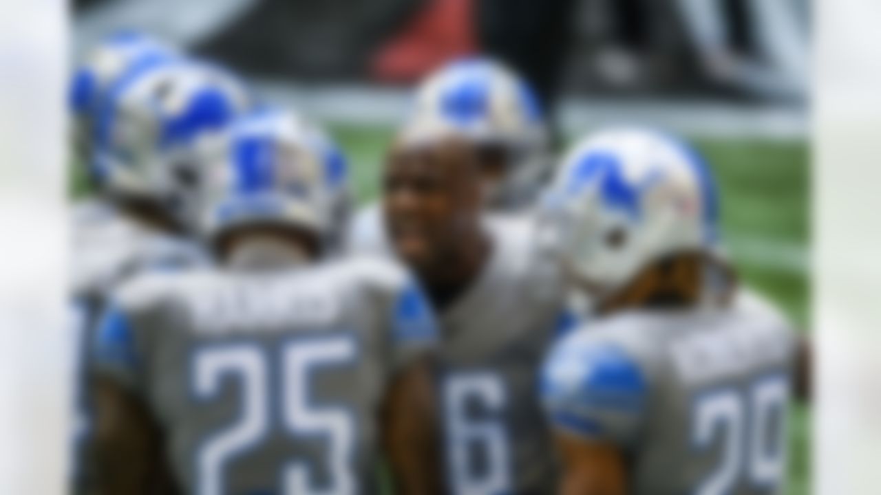 Detroit Lions running back Adrian Peterson (28) speaks to teammates before a game against the Atlanta Falcons.