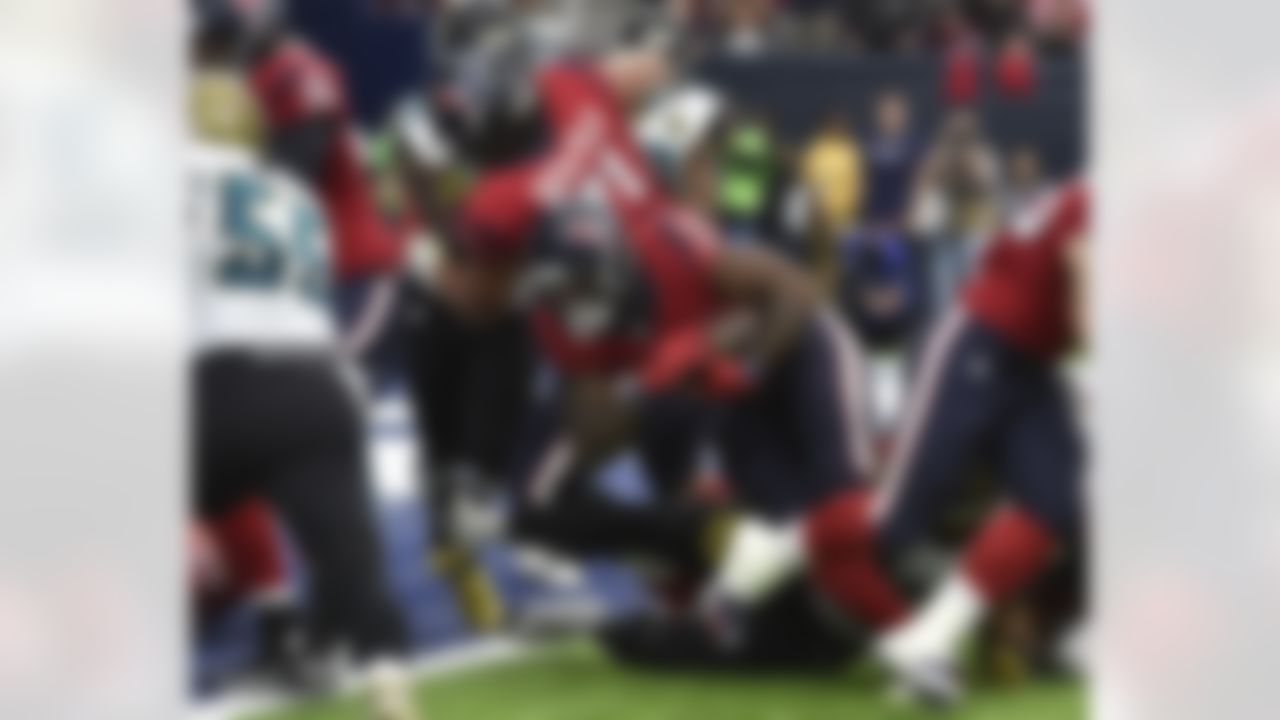 Houston Texans running back Lamar Miller (26) pushes his way into the end zone against the Jacksonville Jaguars during the second half of an NFL football game Sunday, Dec. 18, 2016, in Houston. (AP Photo/Eric Christian Smith)