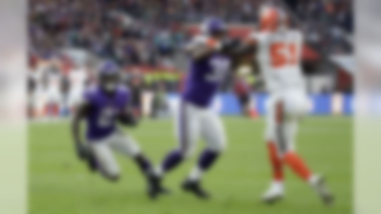 Minnesota Vikings running back Jerick McKinnon, left, scores on a 1-yard touchdown run as Vikings fullback C.J. Ham (30) holds back Cleveland Browns linebacker Jamie Collins Sr. (51) during the second half of an NFL football game against Cleveland Browns at Twickenham Stadium in London, Sunday Oct. 29, 2017. (AP Photo/Matt Dunham)