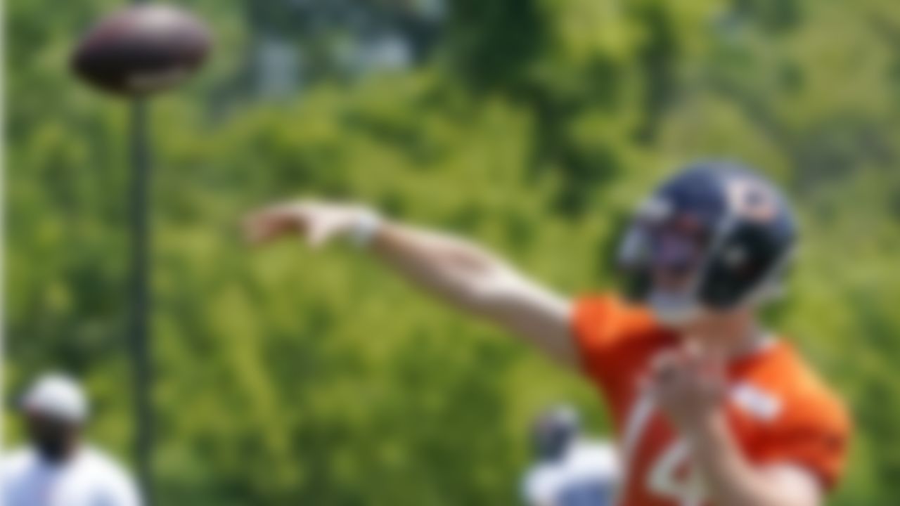 Chicago Bears quarterback Andy Dalton throws a ball during NFL football practice in Lake Forest, Ill., Wednesday, June 9, 2021.