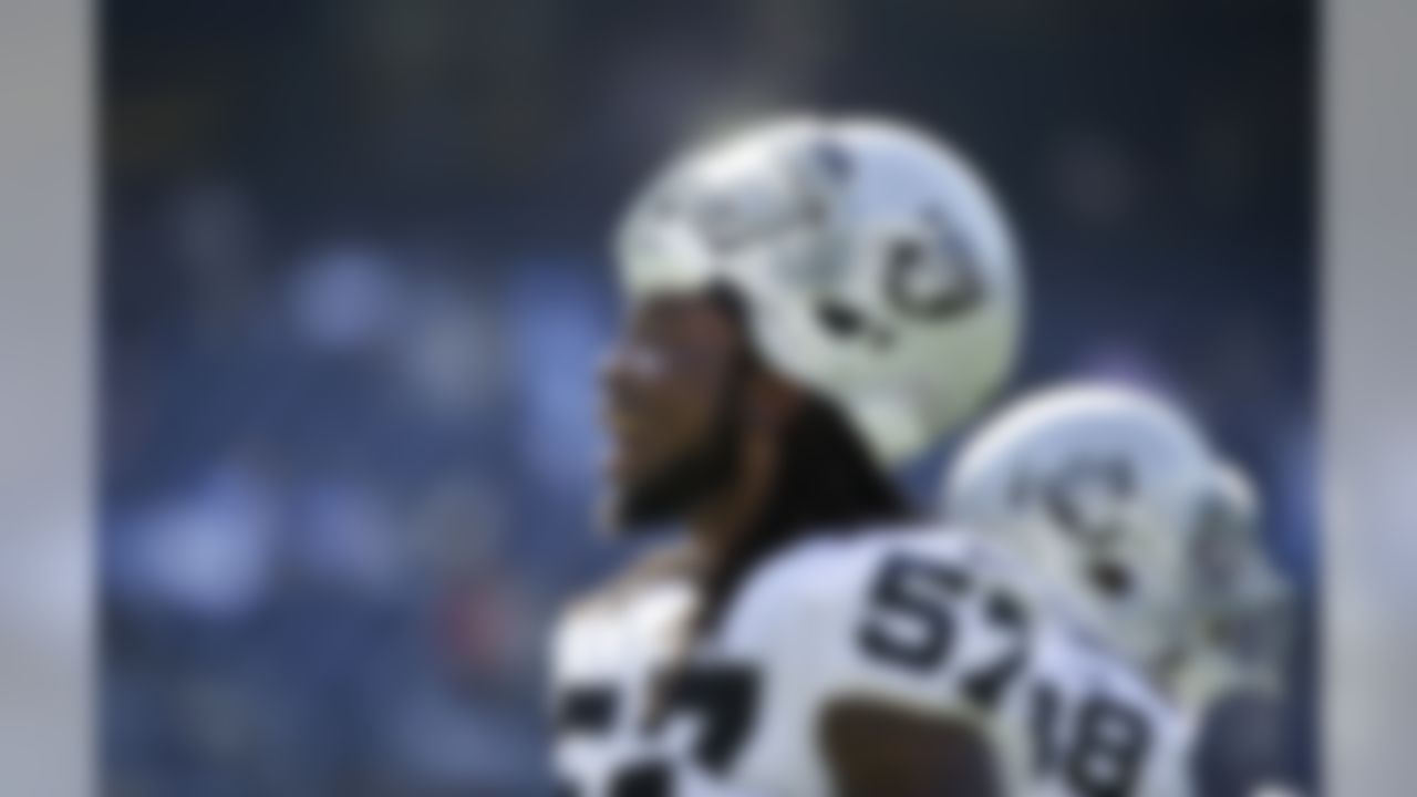 Oakland Raiders linebacker Ray-Ray Armstrong gets involved with fans during warmups prior to an NFL football game against the San Diego Chargers Sunday, Nov. 16, 2014, in San Diego. (AP Photo/Gregory Bull)