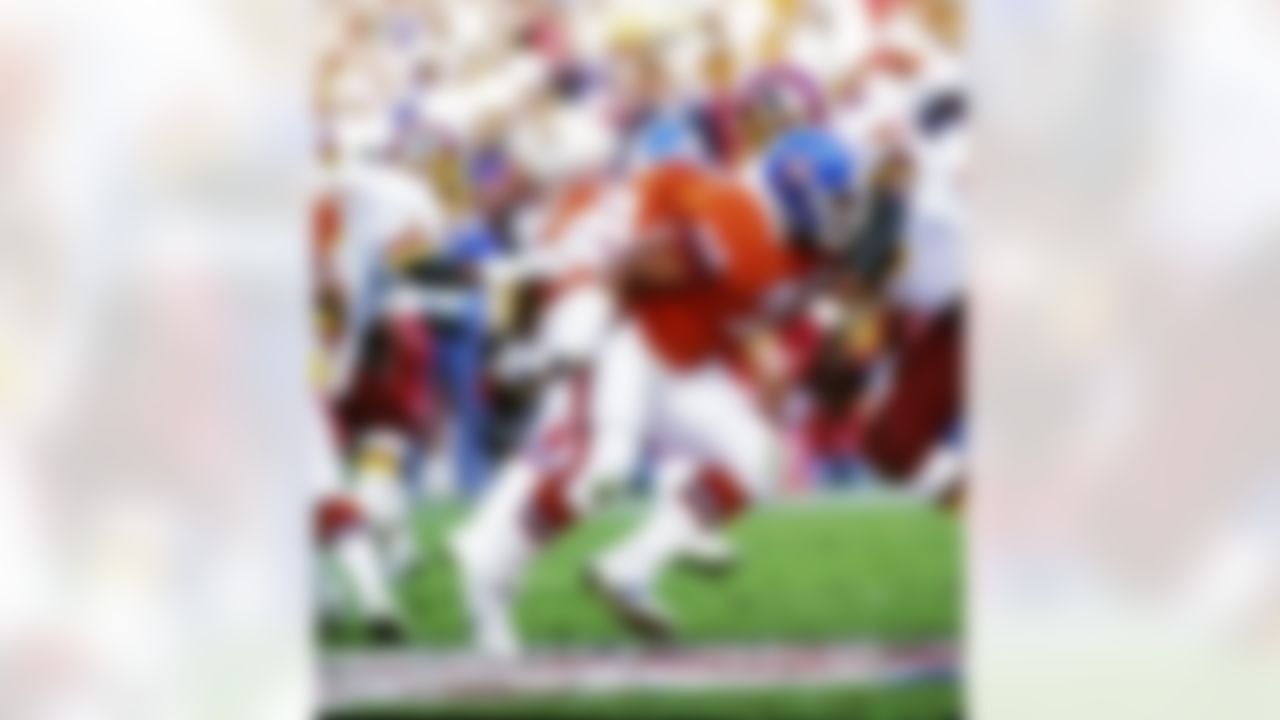 Denver Broncos tackle Ken Lanier (76) blocks Washington Redskins defensive end Charles Mann (71) during Super Bowl XXII, a 42-10 Redskins victory on January 31, 1988, at Jack Murphy Stadium in San Diego, CA. (National Football League)