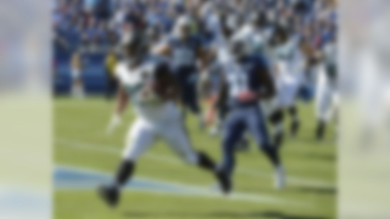 Jacksonville Jaguars running back Maurice Jones-Drew (32) scores a touchdown on a 6-yard run as Tennessee Titans safety Bernard Pollard (31) defends in the first quarter of an NFL football game on Sunday, Nov. 10, 2013, in Nashville, Tenn. (AP Photo/Mark Zaleski)