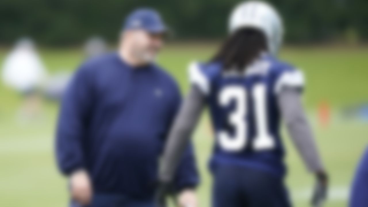 Dallas Cowboys head coach Mike McCarthy smiles as corner back Maurice Canady (31) walks by during an NFL football team practice Wednesday, June 9, 2021, in Frisco, Texas.