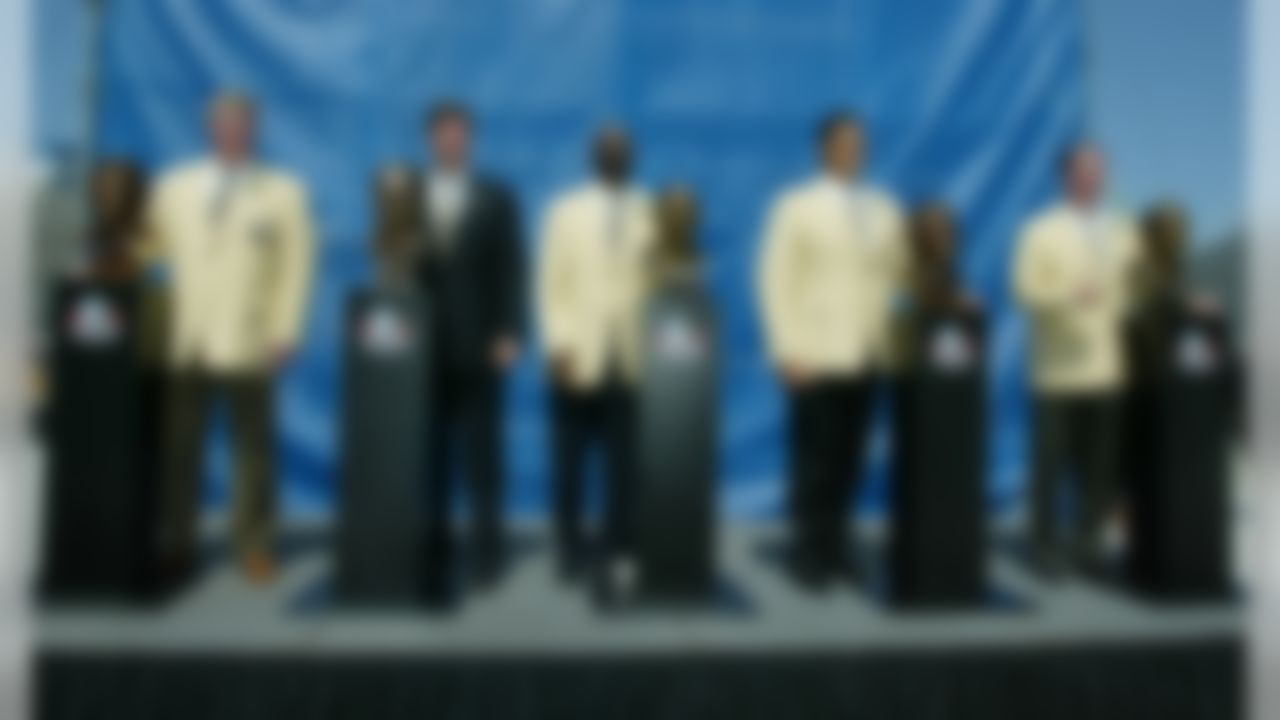 The Class of 2002 pose with their busts after enshrinement into the Pro Football Hall of Fame in Canton, Ohio Saturday, Aug. 3, 2002. From left: Dave Casper, Sen. George Allen for his father, the late coach George Allen, John Stallworth, Dan Hampton and Jim Kelly. (AP Photo/Ron Schwane)