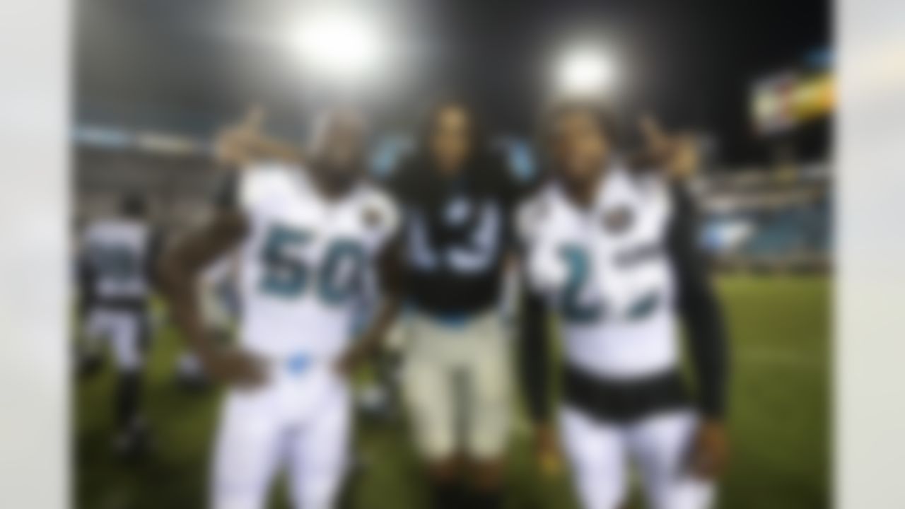 Jacksonville Jaguars outside linebacker Telvin Smith (50) and Jacksonville Jaguars cornerback Jalen Ramsey (20) pose for a photo with Carolina Panthers wide receiver Kelvin Benjamin (13) after a NFL preseason game, Thursday, Aug. 24, 2017 in Jacksonville, Fla. (Logan Bowles / NFL)